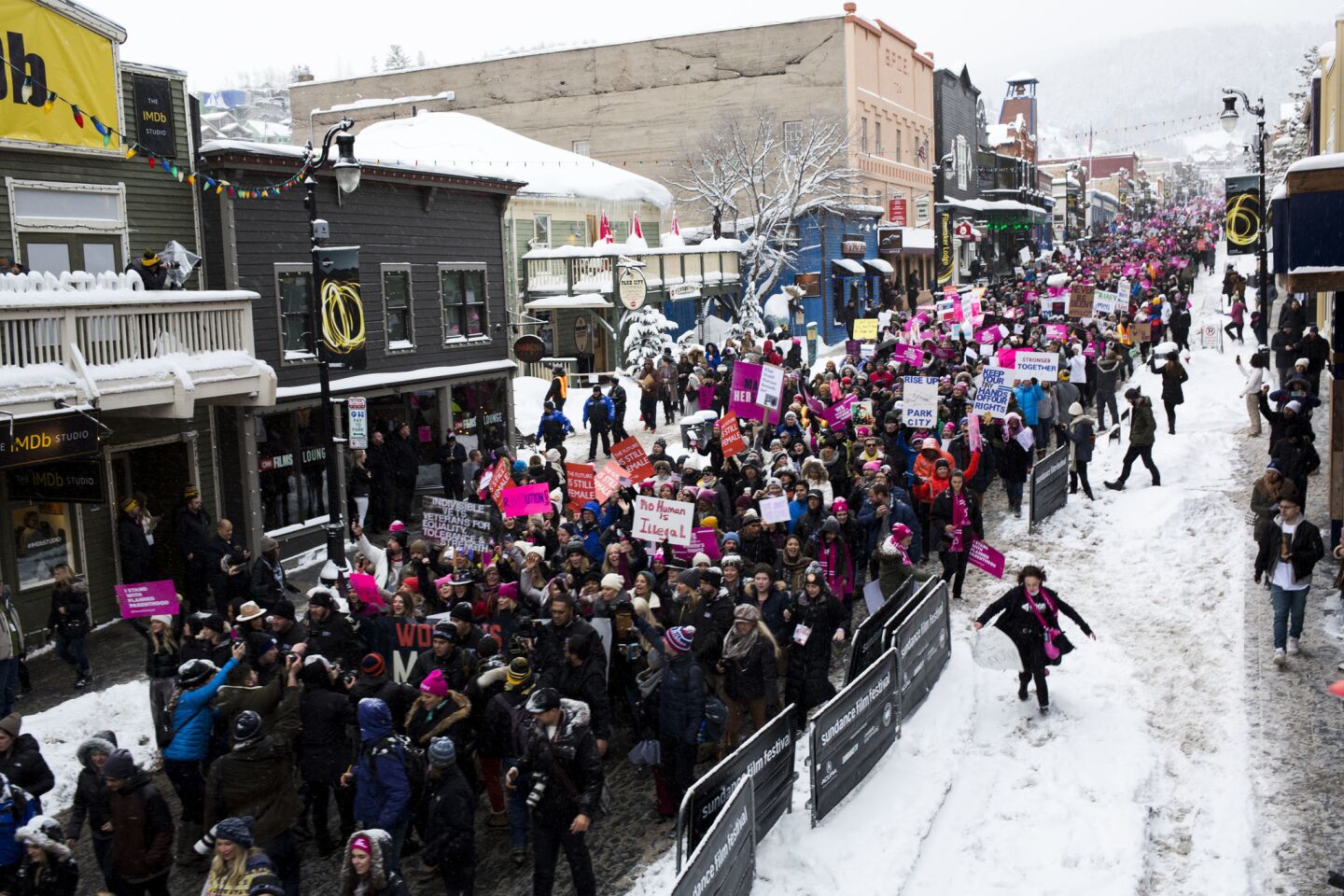 People march down Main St. during a march for women's rights at the Sundance film festival.