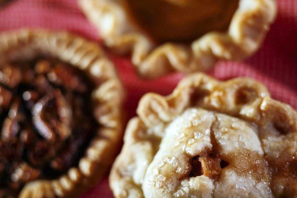 Mini pies, clockwise from top: pumpkin chiffon, apple and pecan.