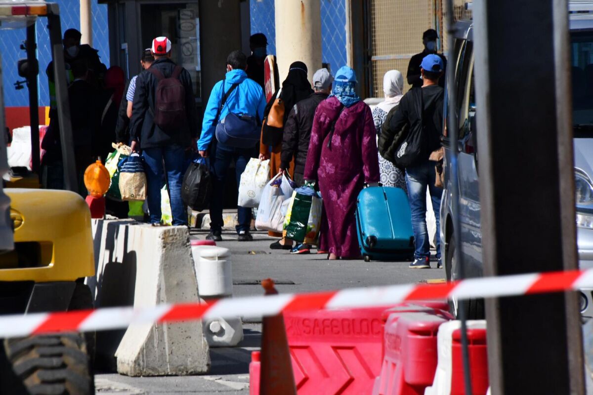 In this Friday photo, Moroccan citizens wait for repatriation after being stranded in Spain because of the coronavirus pandemic in the Spanish enclave of Ceuta, Spain.
