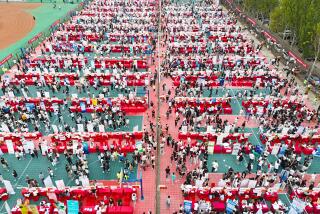 QINGDAO, CHINA - SEPTEMBER 23, 2023 - College students look for suitable positions at the autumn campus double selection fair of Shandong University of Science and Technology in Qingdao, Shandong province, China, Sept 23, 2023. (Photo credit should read CFOTO/Future Publishing via Getty Images)