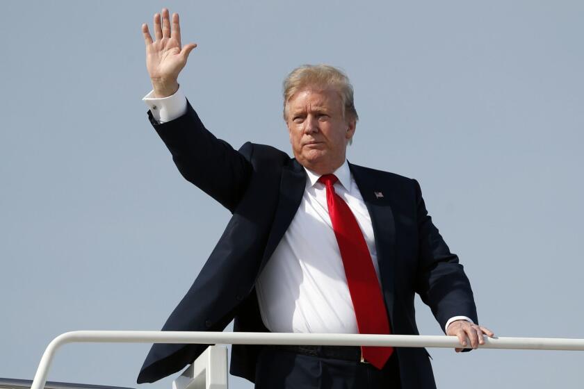 President Donald Trump waves as he board sAir Force One, Thursday, April 18, 2019, at Andrews Air Force Base, Md. President Trump is traveling to his Mar-a-Lago estate to spend the Easter weekend in Palm Beach, Fla. (AP Photo/Pablo Martinez Monsivais)