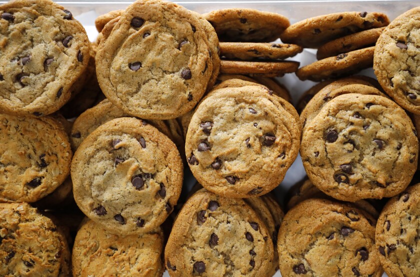 Pumpkin spice chocolate chip cookies are stacked at Maya's Cookies, a gourmet vegan cookie company.