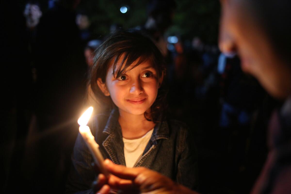 A young girl participates in a Yazidi New Year celebration at a shrine near Mosul in 2015.