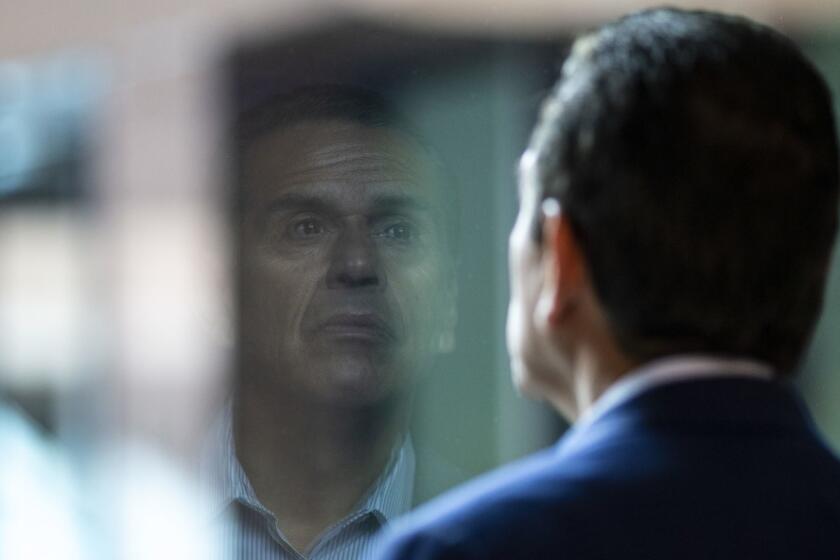 Antonio Villaraigosa pauses, looking out a window before a radio interview in Los Angeles.