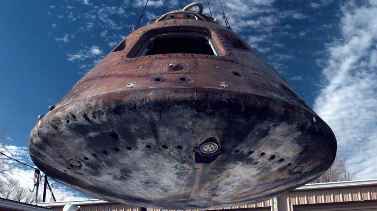 The command module from the 13th Lunar mission in 1995 at the Space Works Facility in Hutchinson, Kansas, where it was restored for display at the Kansas Cosmosphere and Space Center. (Dan Bayer / Associated Press)