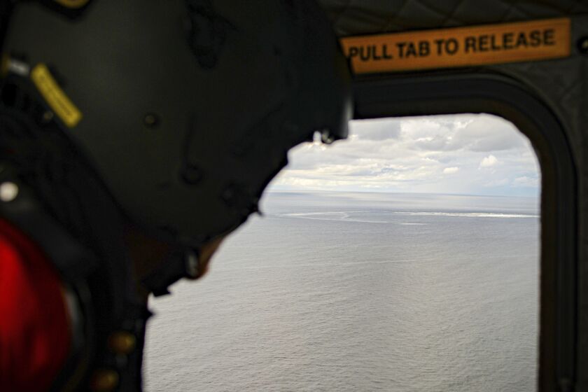 In this photo provided by the Armed Forces of Denmark, the crew in a helicopter of the Armed Forces monitors the gas leak, in the Baltic Sea, Thursday, Sept. 29, 2022. Following the suspected sabotage this week of the Nord Stream 1 and 2 pipelines that carry Russian natural gas to Europe, there were two leaks off Sweden, including a large one above North Stream 1, and a smaller one above North Stream 2. (Rune Dyrholm/Armed Forces of Denmark via AP)