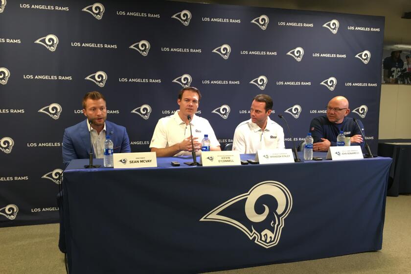 From left, Rams coach Sean McVay introduces Kevin O'Connell, Brandon Staley and John Bonamego in February 2020.