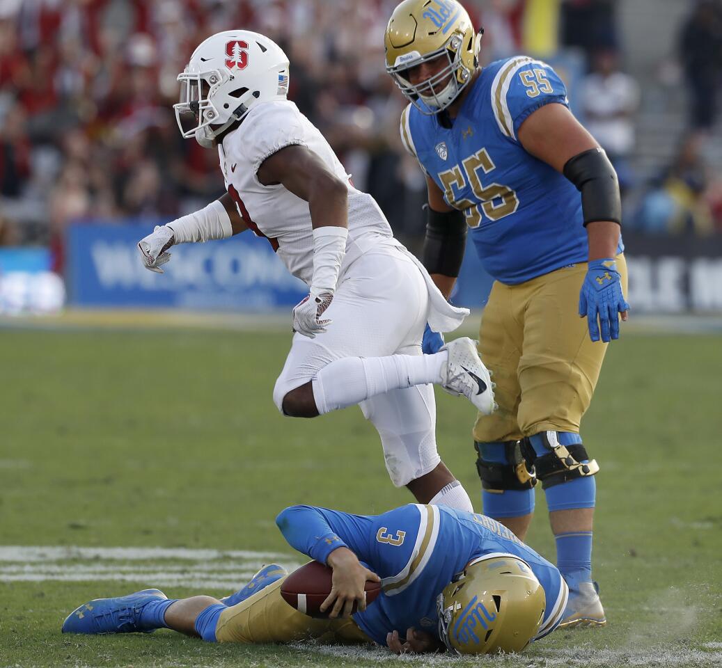 UCLA quarterback Wilton Speight stays down after getting sacked on fourth down by Stanford safety Malik Antonie during the fourth quarter.