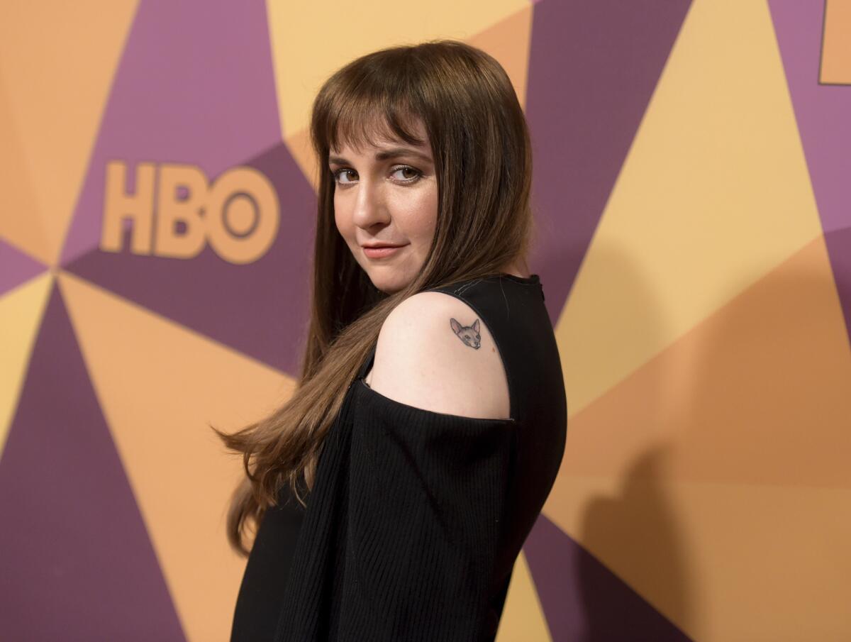 Lena Dunham, shown at a Golden Globes after party in January, revealed in a selfie posted from the hospital that she her left ovary removed.