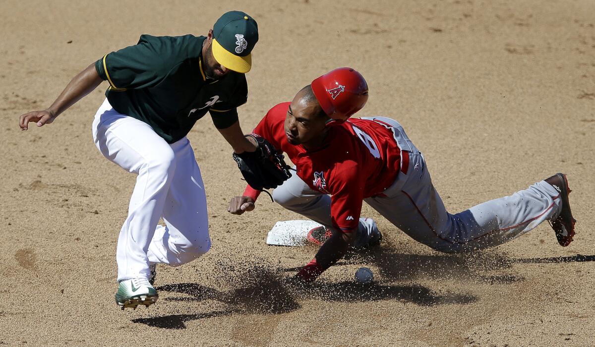 Angels pinch-runner D'Arby Myers steals second Marcus Semien and the A's on Saturday.