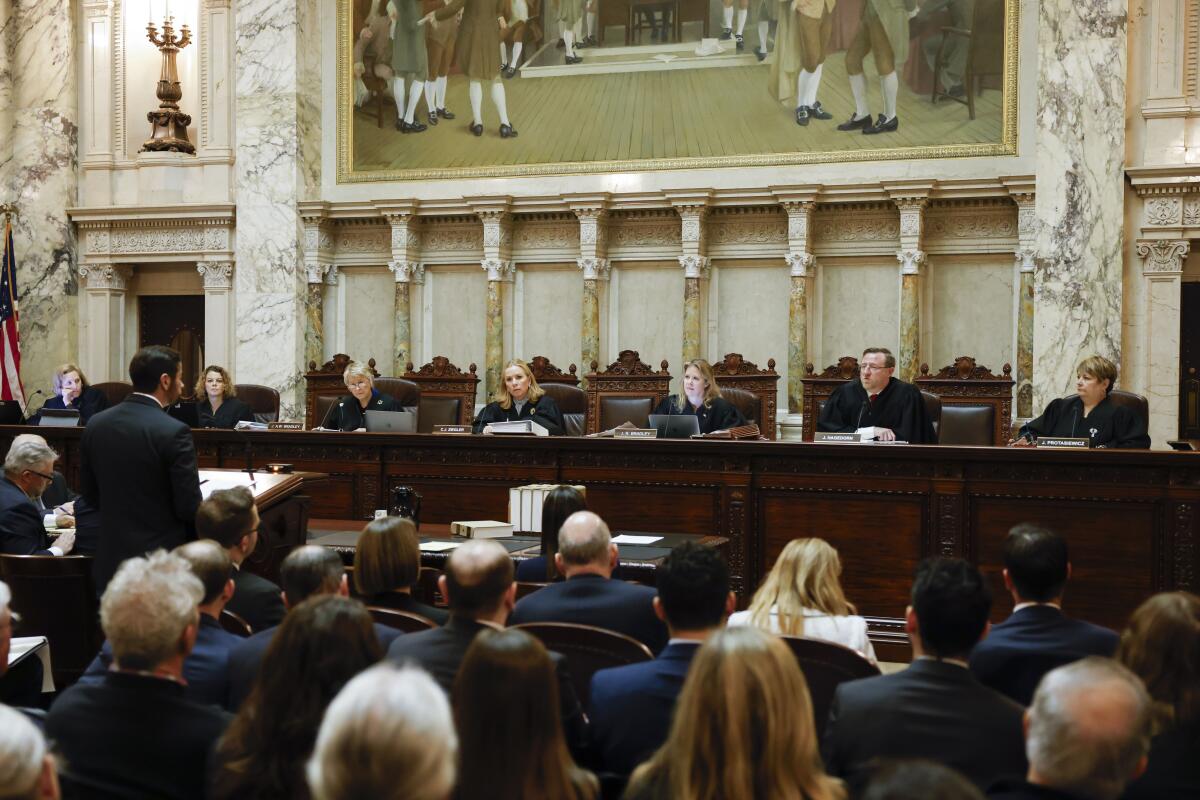 The Wisconsin Supreme Court listens to arguments from Wisconsin Assistant Atty. Gen. Anthony D. Russomanno.