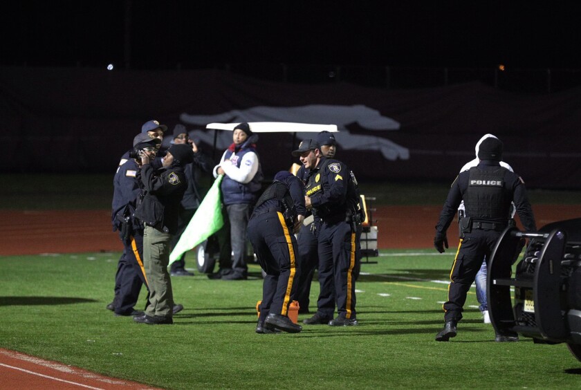 Shooting wounds two, causes panic at high school football game in New
