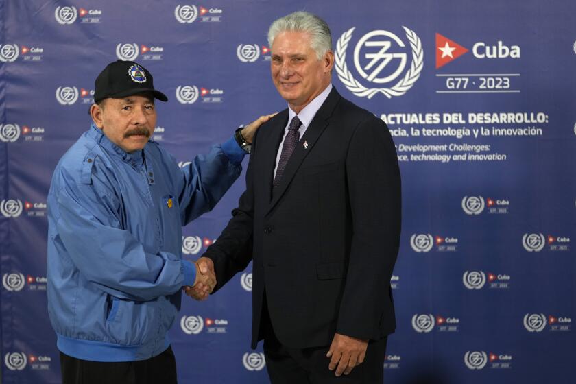 FILE - Cuban President Miguel Diaz-Canel, right, shakes hands with Nicaragua's President Daniel Ortega during a photo opportunity at the G77+China summit in Havana, Cuba, Friday, Sept. 15, 2023. The U.S. State Department called Nicaragua’s formal withdrawal from the Organization of American States on Sunday, Nov. 19, “another step away from democracy.” The regional body, known by its initials OAS, has long criticized rights violations under Nicaraguan President Daniel Ortega. Ortega, who governs alongside his wife, Vice President Rosario Murillo, has rejected those criticisms and started the two-year process to leave the OAS in November 2021. (AP Photo/Ramon Espinosa)