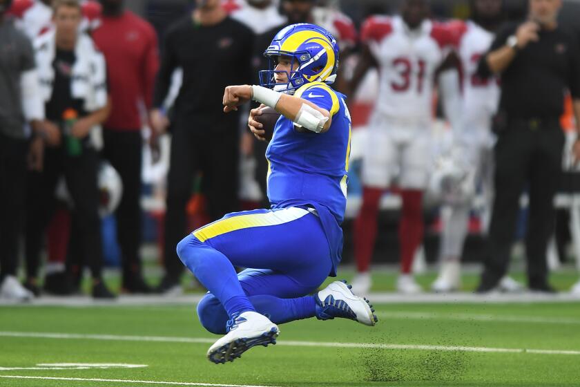 Inglewood, CA. October 3, 2021: Rams quarterback Matthew Stafford scrambles for a first down.