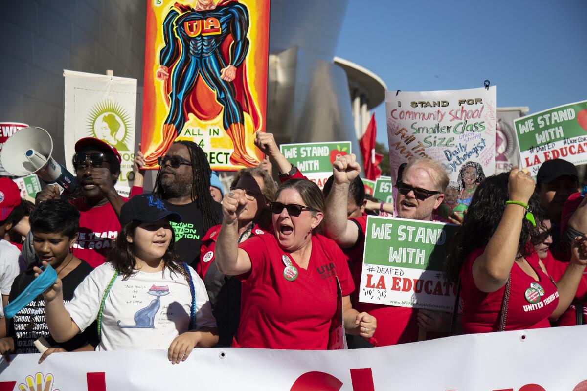 Thousands organized by UTLA march on Grand Avenue near the Broad Museum on Saturday.