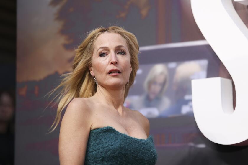 Gillian Anderson poses for photographers upon arrival at the World premiere of the film 'Scoop' on Wednesday, March 27, 2024 in London. (Photo by Vianney Le Caer/Invision/AP)
