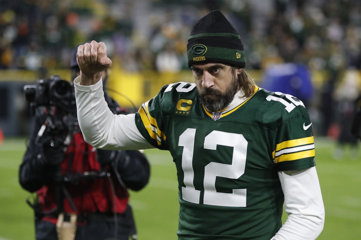 Packers quarterback Aaron Rodgers reacts after beating the Rams on Sunday.