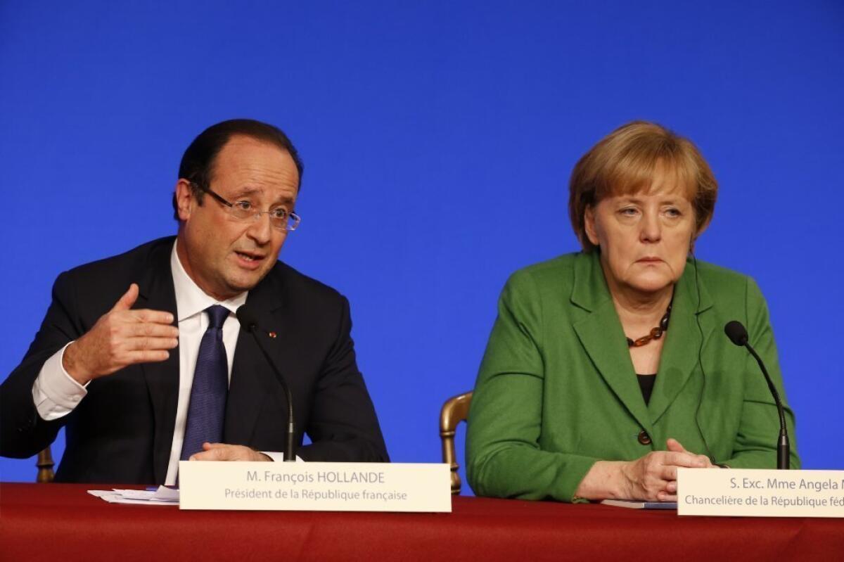 French president François Hollande, left, and German Chancellor Angela Merkel hold a press conference during a European Union leaders conference to discuss ways of tackling youth unemployment at the Elysee palace in Paris.
