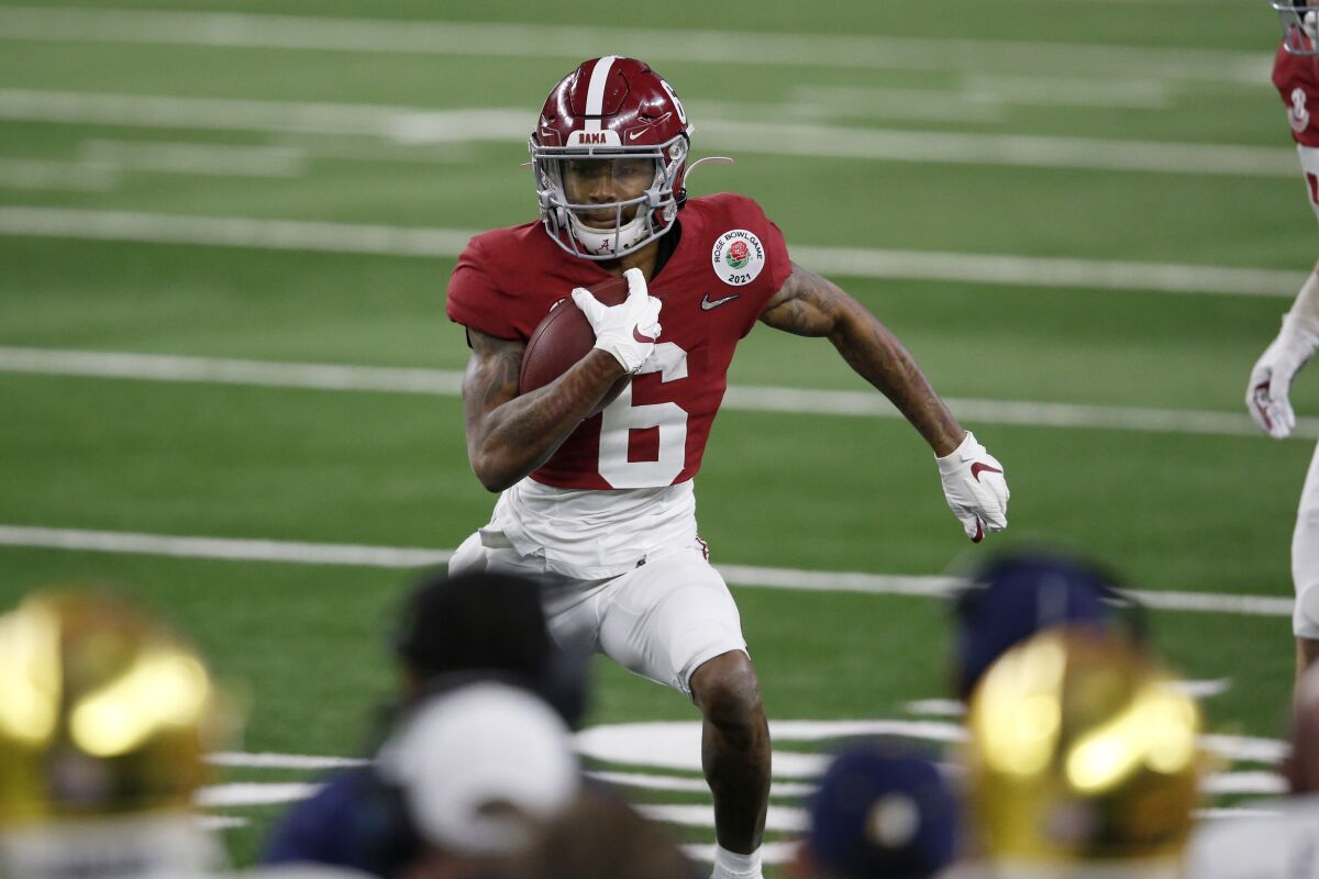 Alabama wide receiver DeVonta Smith runs with the ball against Notre Dame.