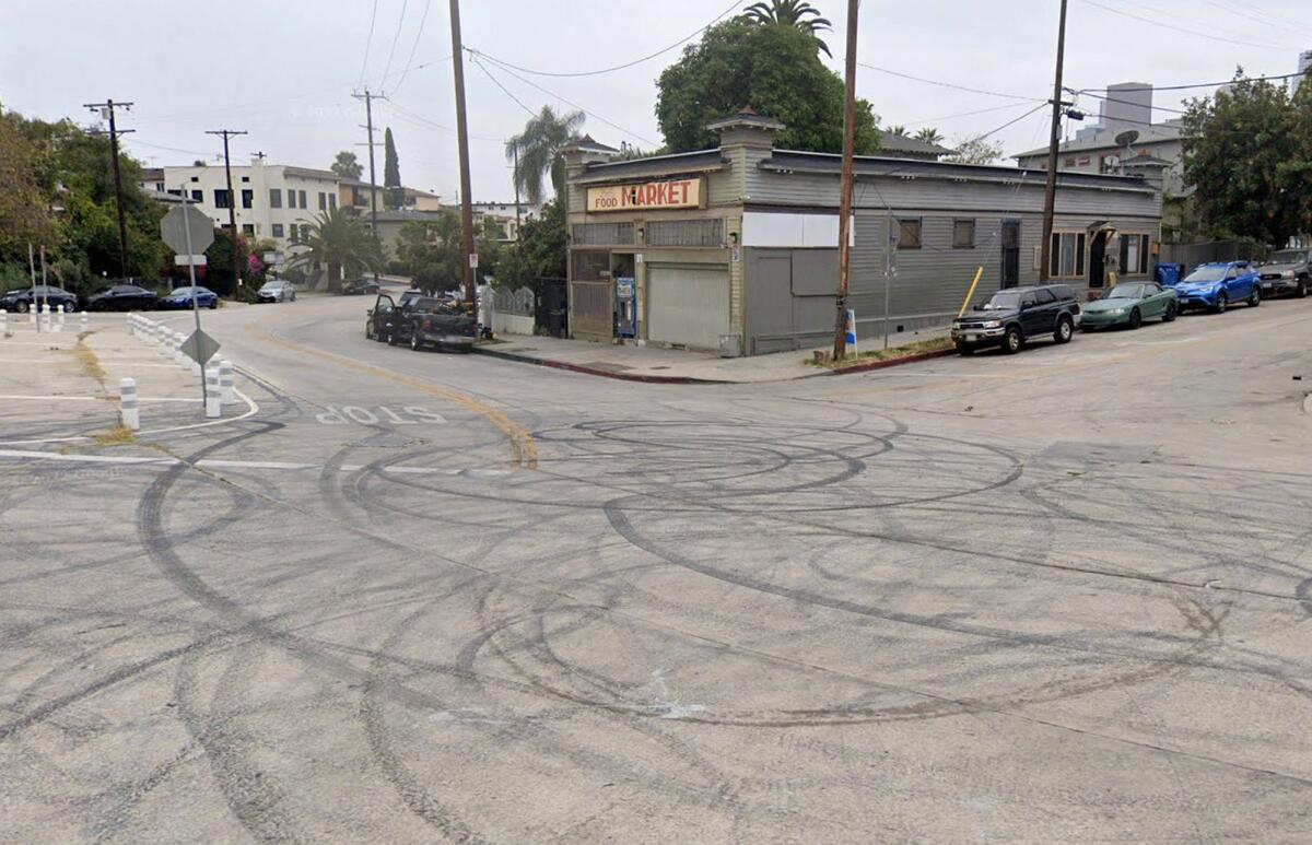 Circular tire marks in an intersection.