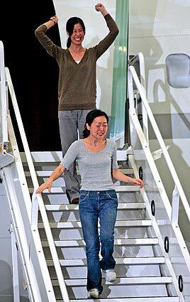 Journalists Laura Ling, top, and Euna Lee arrive in Burbank. They returned with former President Clinton after he had secured their release from North Korea. The two journalists were on assignment for San Francisco-based Current TV, a cable and satellite channel co-founded by former Vice President Al Gore, when they were arrested at the China-North Korea border.