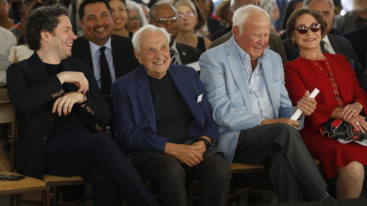 L.A. Phil conductor Gustavo Dudamel, left, architect Frank Gehry and YOLA Center donors Thomas and Judith Beckmen at the design unveiling Wednesday.