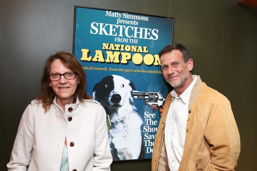 Judy Belushi Pisano and Bill Belushi pose during the world premier of "Sketches From The National Lampoon" in 2013