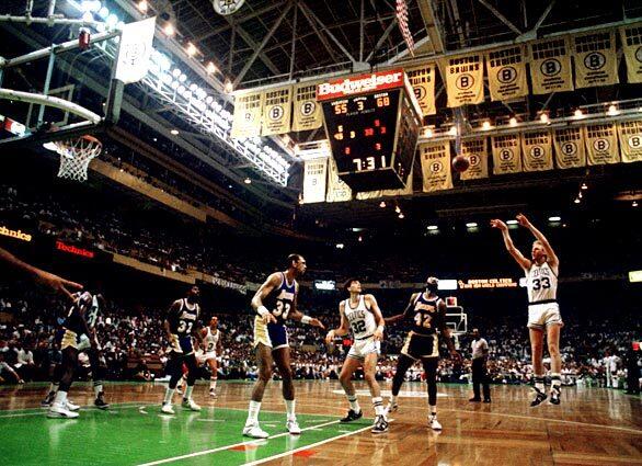 The Celtics Larry Bird fires a jump shot during a 1987 NBA Finals game at Boston Garden.