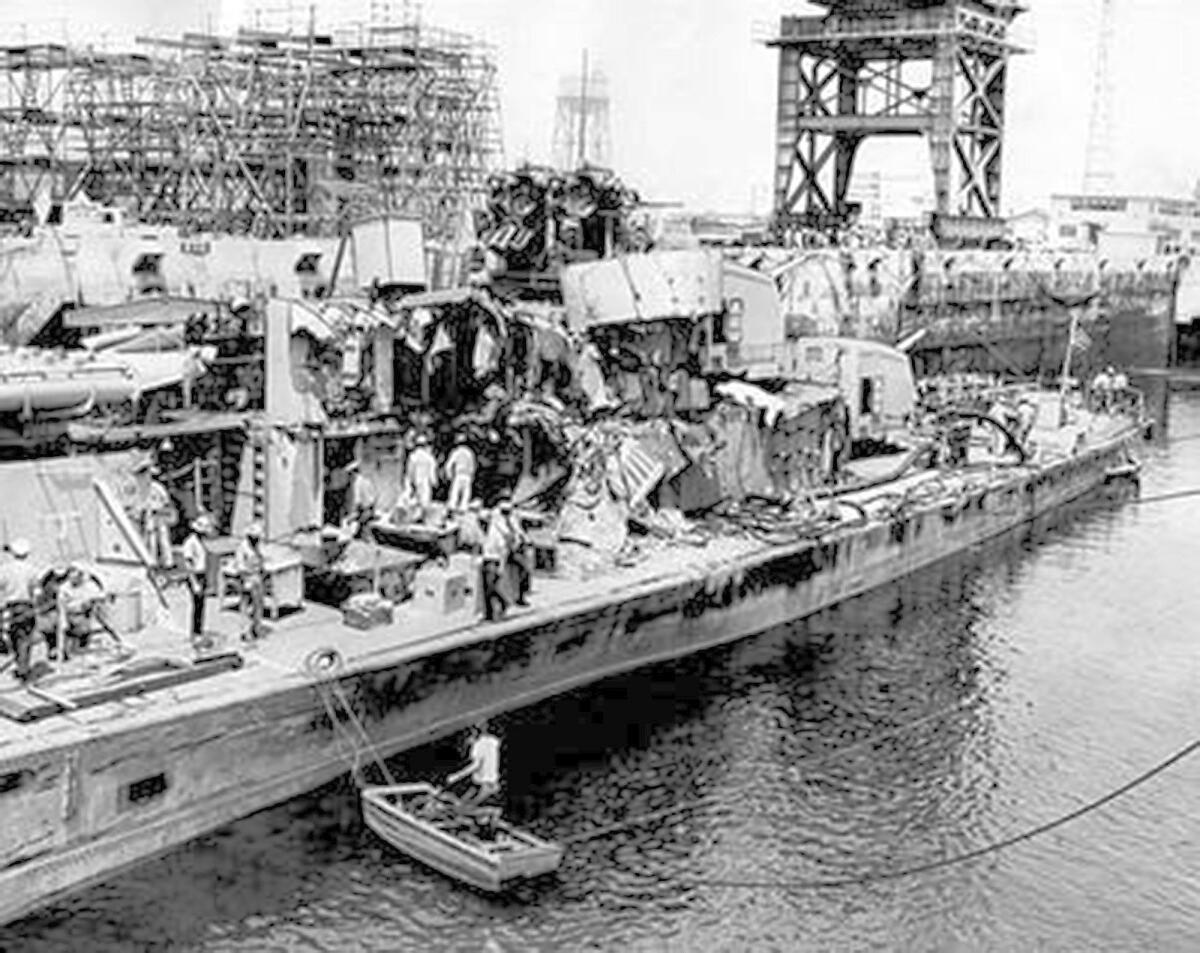 Wreckage from the USS Ammen that contained three sailors' bodies is removed in a Terminal Island drydock the day of the collision with the Ammen off Newport Beach.