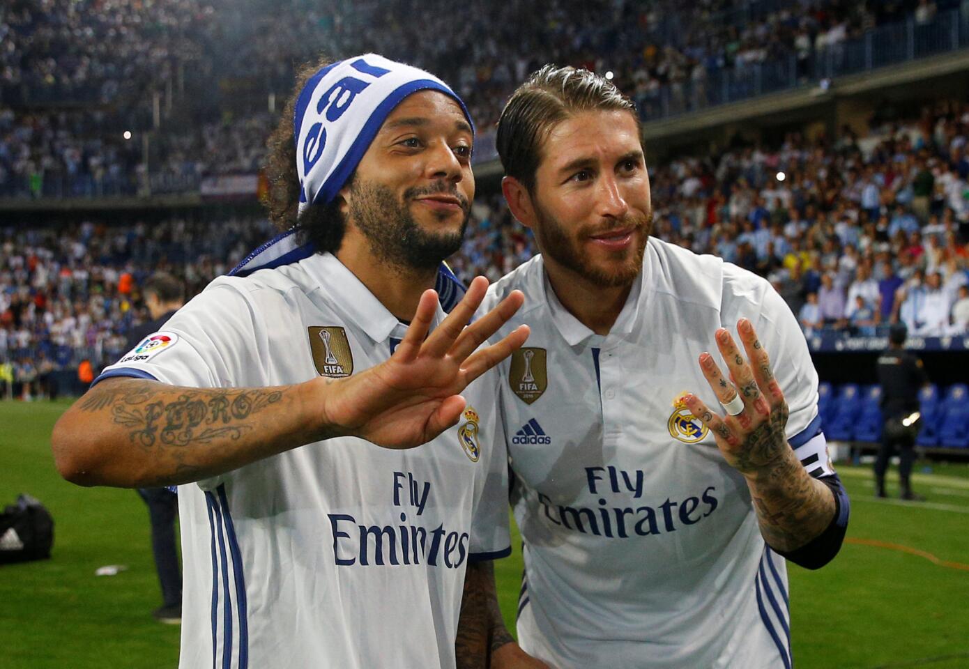 Football Soccer - Malaga v Real Madrid - Spanish Liga Santander - La Rosaleda, Malaga, Spain - 21/5/17 Real Madridâ€™s Marcelo and Sergio Ramos celebrate after winning La LigaReuters / Juan Medina ** Usable by SD ONLY **