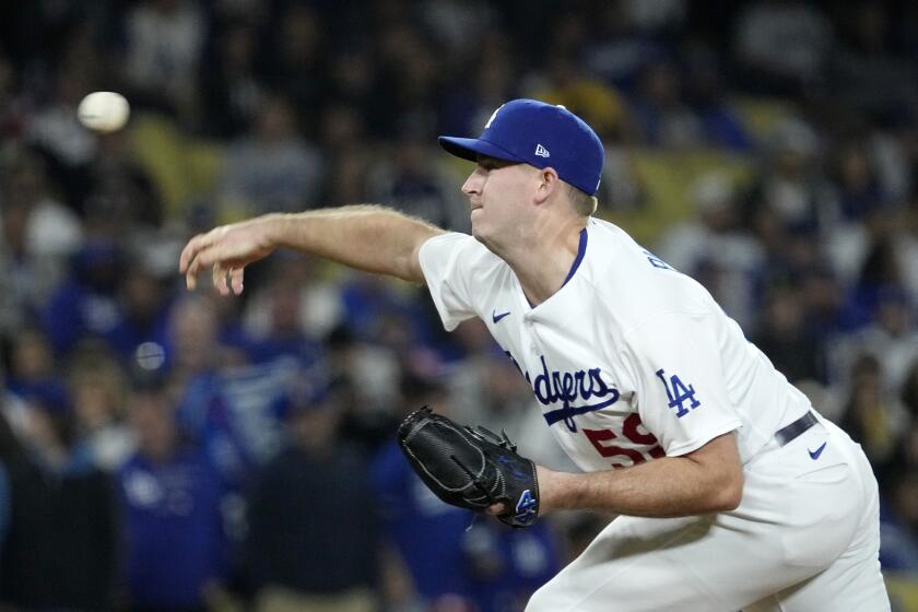 Los Angeles Dodgers relief pitcher Evan Phillips throws to the plate during the ninth inning of a baseball game against the San Diego Padres Friday, May 12, 2023, in Los Angeles. (AP Photo/Mark J. Terrill)