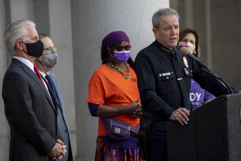 LOS ANGELES, CA - NOVEMBER 30, 2021: Los Angeles Police Chief Michel Moore speaks during a press conference announcing the ban on ghost guns at City Hall on November 30, 20201 in Los Angeles, California. Los Angeles City Councilmen Paul Krekorian, left, and Paul Koretz stand behind Moore with gun control advocates Brady United, far right.(Gina Ferazzi / Los Angeles Times)