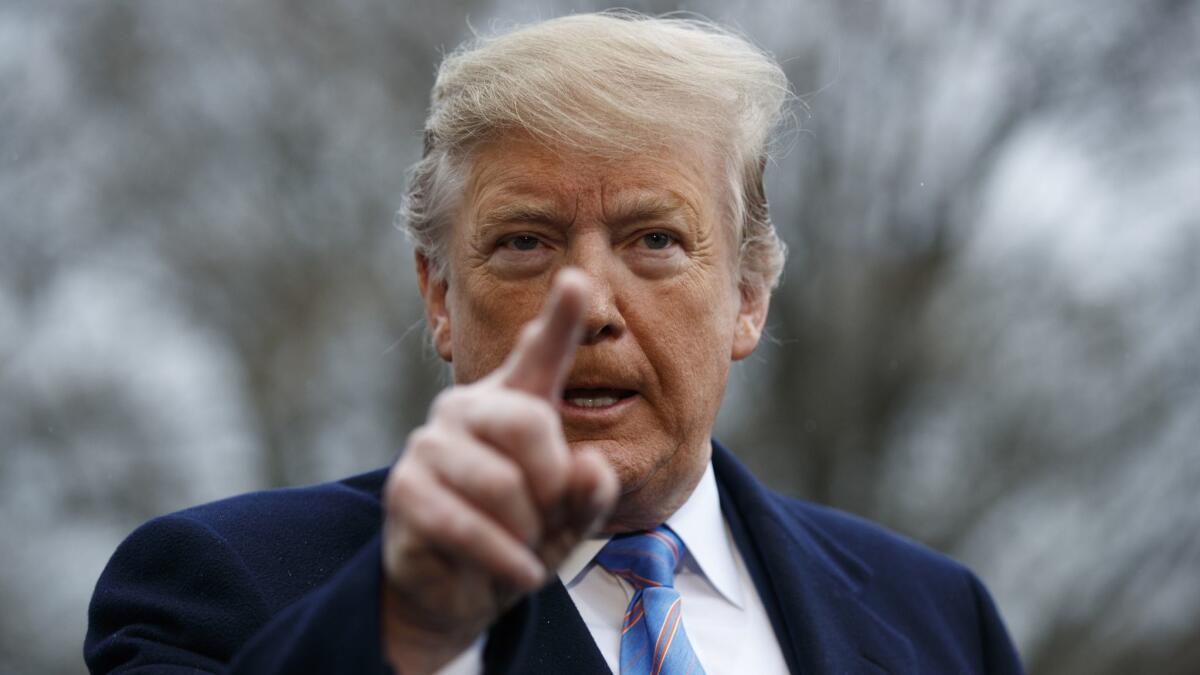 President Trump speaks with reporters before boarding Marine One on the South Lawn of the White House on April 5.