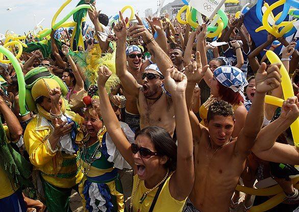 At the Copacabana beach in Rio de Janeiro, people celebrate their city's victory in the sweepstakes to host the 2016 Olympic Games.