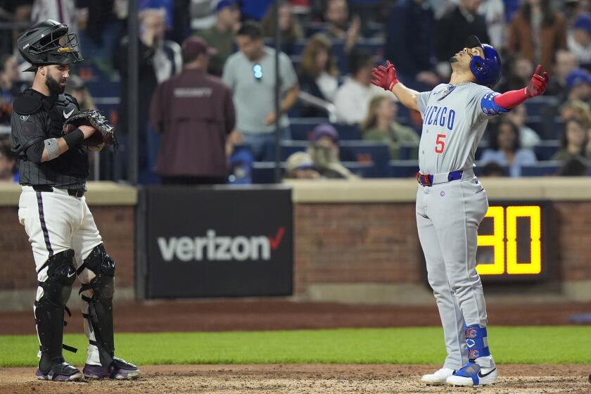 New York Mets catcher Tomás Nido reacts as Chicago Cubs' Christopher Morel (5) stands at home plate after hitting a two-run home run during the ninth inning of a baseball game, Monday, April 29, 2024, in New York. (AP Photo/Frank Franklin II)