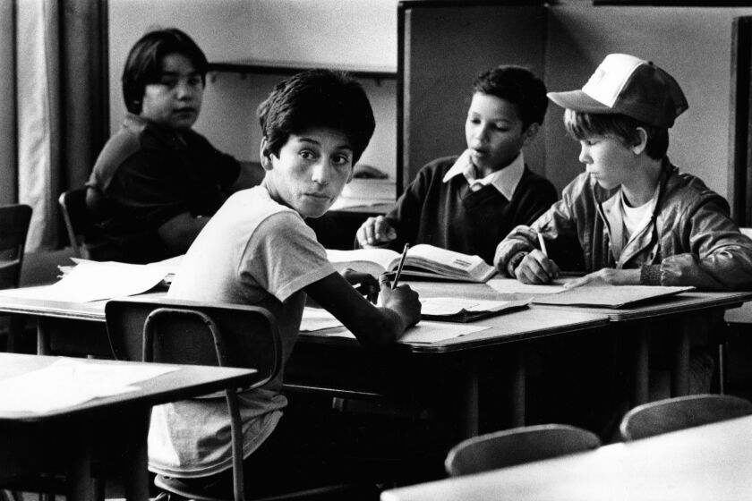 April 20, 1983: Ernie Galvez in class at Killingsworth Junior High School in Hawaiian Gardens. He is in t-shirt looking toward camera.