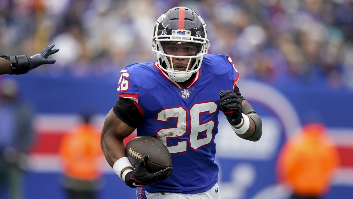 New York Giants running back Saquon Barkley runs the ball against the Chicago Bears during the first quarter.