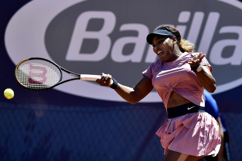 Serena Williams of the United States returns the ball to Italy's Lisa Pigato during their match at the Emilia Romagna Open.