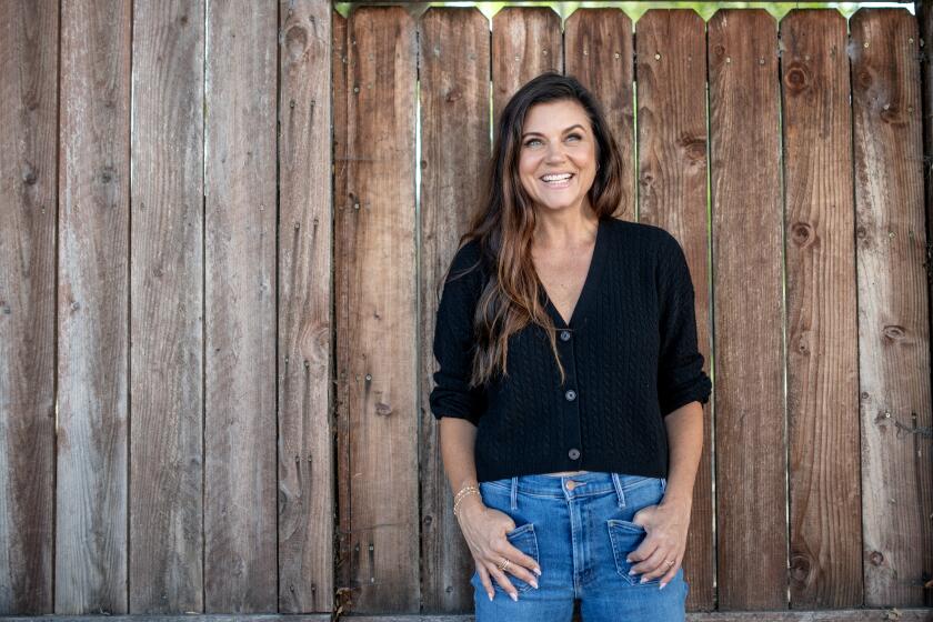 LONG BEACH, CA - SEPTEMBER 19: Portrait of Tiffani Thiessen outside Johnny Rebs' True South