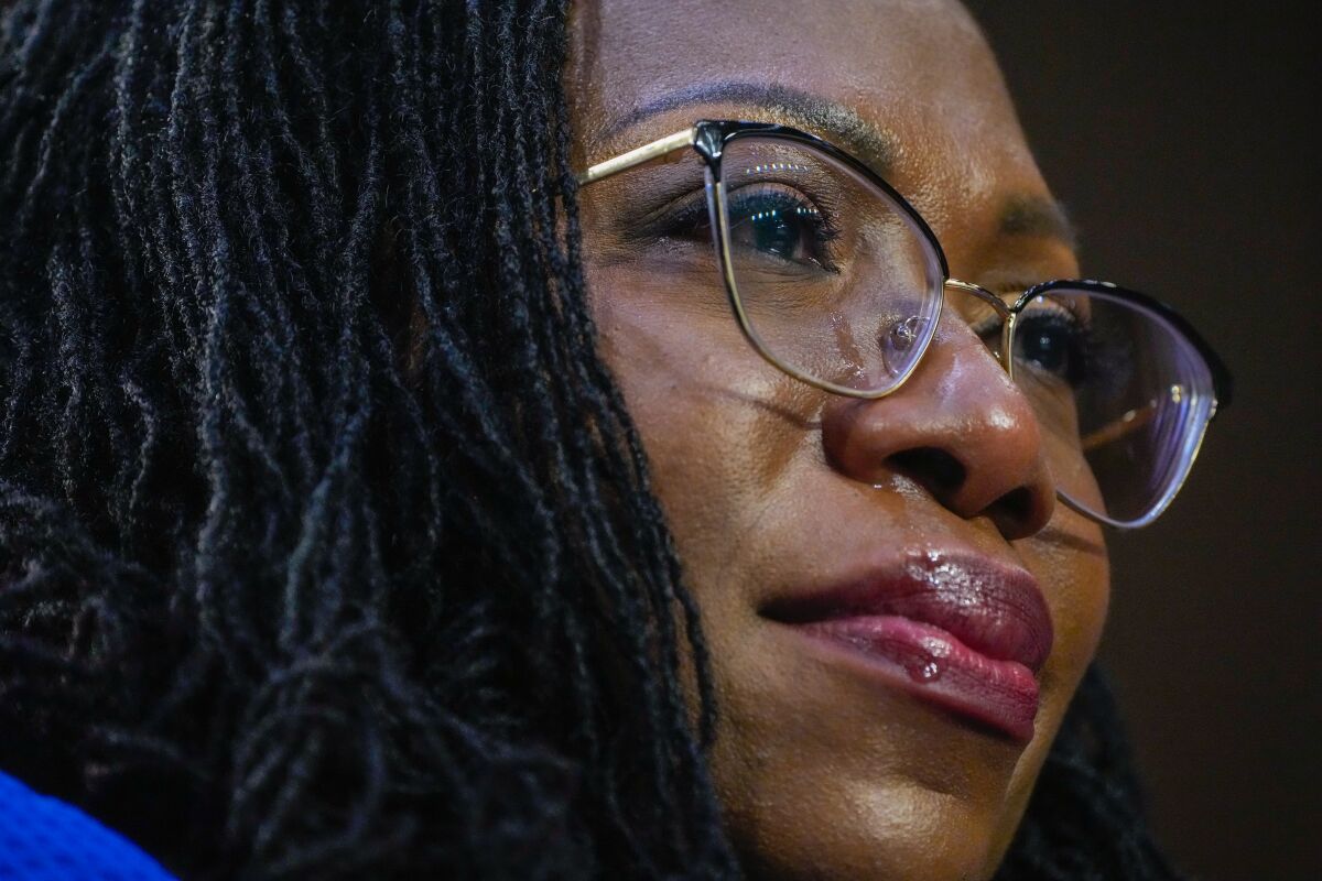 A closeup of Judge Ketanji Brown Jackson's face as a tear runs down it