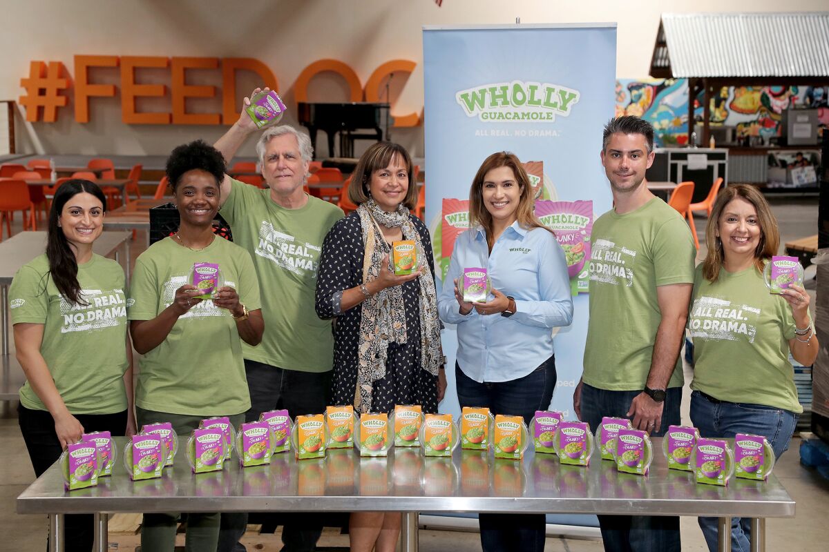 Second Harvest CEO Claudia Keller with Diana De Loza, MegaMex Foods, and members of the Wholly Guacamole team.