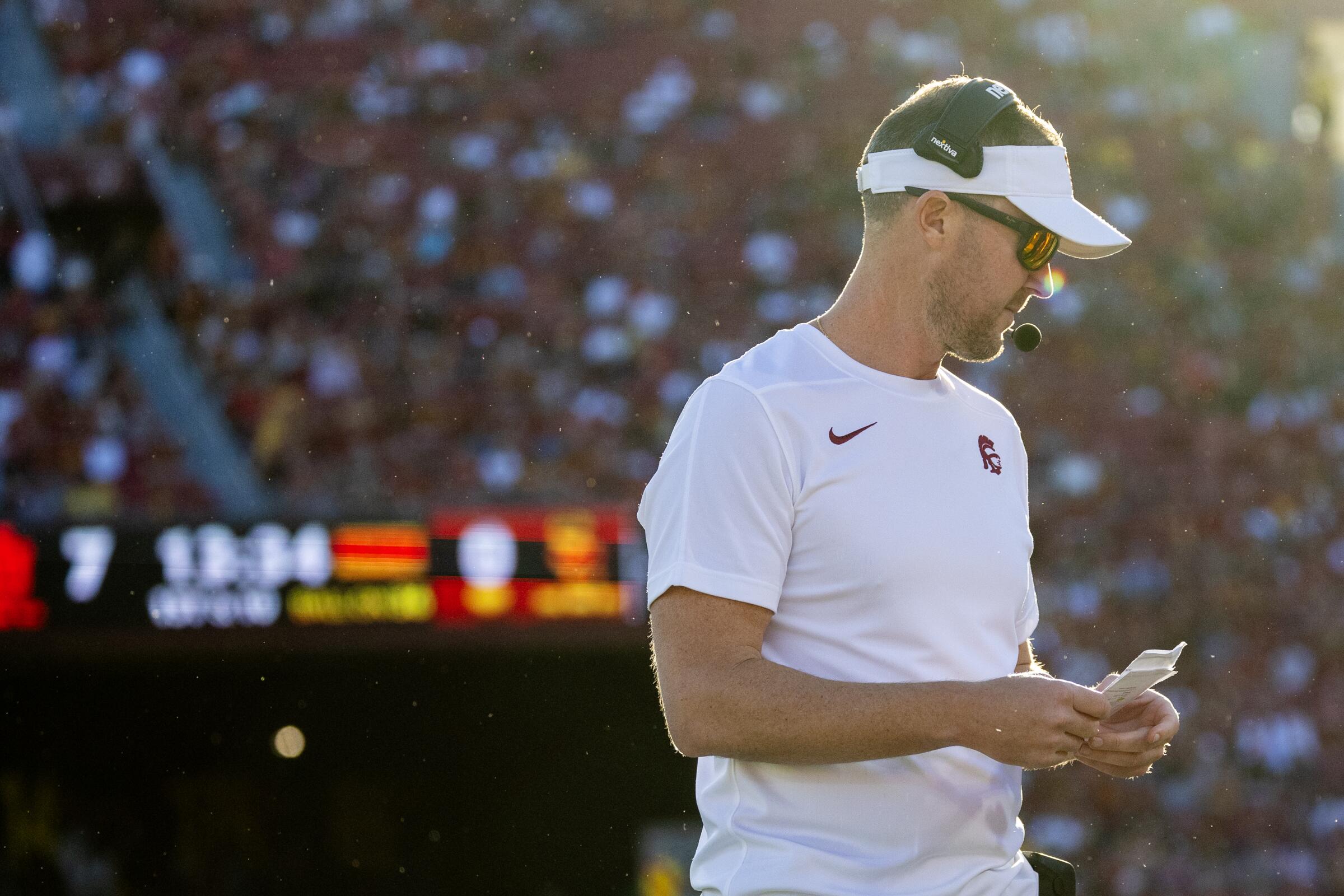 USC coach Lincoln Riley stands on the sideline during a loss to Utah at the Coliseum on Oct. 21.