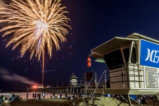 Fireworks ignite over the Huntington Beach Pier on July 4, 2019.