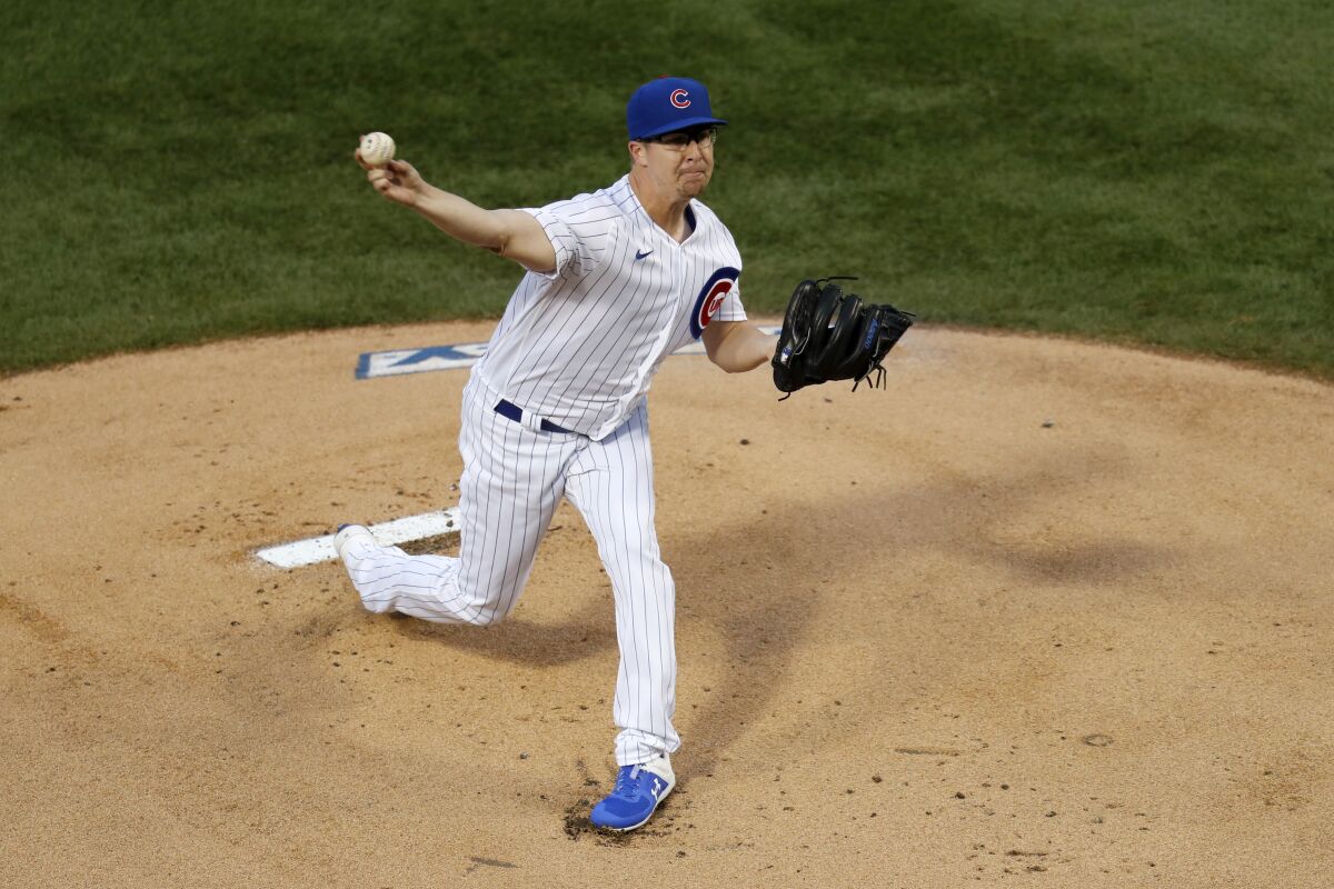 Chicago Cubs starting pitcher Alec Mills delivers during the first inning of a baseball game against the Kansas City Royals Monday, Aug. 3, 2020, in Chicago. (AP Photo/Charles Rex Arbogast)