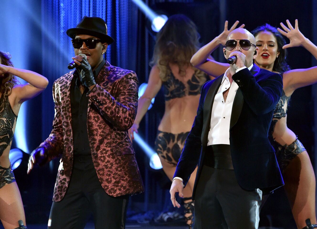 Recording artist Ne-Yo, left, and host Pitbull take to the stage.