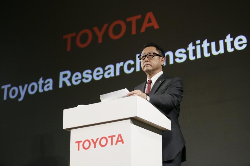 Akio Toyoda, president of Toyota Motor Corp., announces Nov. 6, 2015, during a news conference in Tokyo that Toyota will establish a new artificial intelligence research and development company.