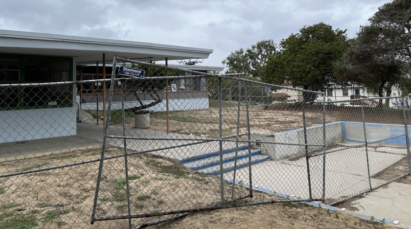 Chain link fencing surrounds the long-closed Pacific View Elementary School. 