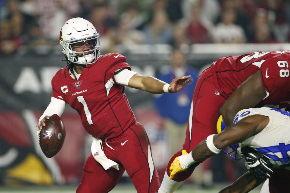 Arizona Cardinals quarterback Kyler Murray looks for running room against the Los Angeles Rams during the first half of an NFL football game Monday, Dec. 13, 2021, in Glendale, Ariz. (AP Photo/Ralph Freso)