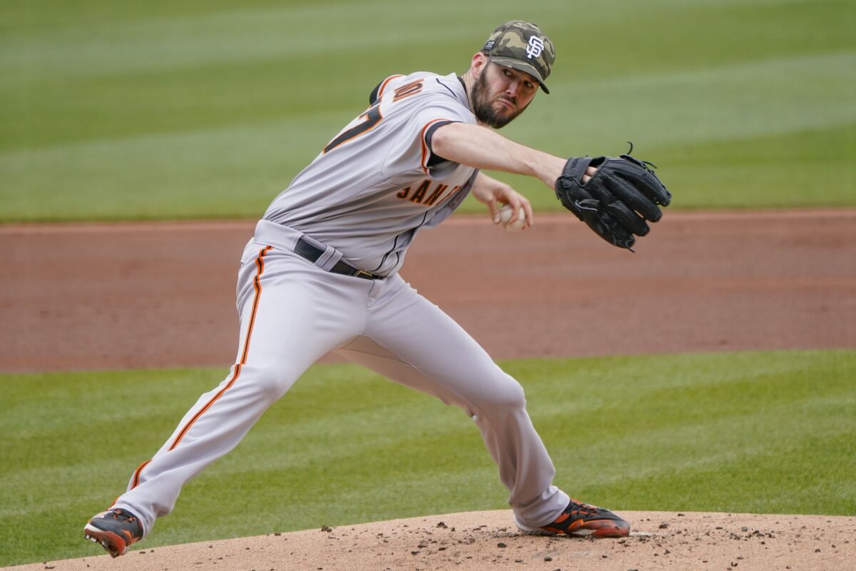 San Francisco Giants starter Alex Wood pitches against the Pittsburgh Pirates in the first inning of a baseball game, Sunday, May 16, 2021, in Pittsburgh. (AP Photo/Keith Srakocic)