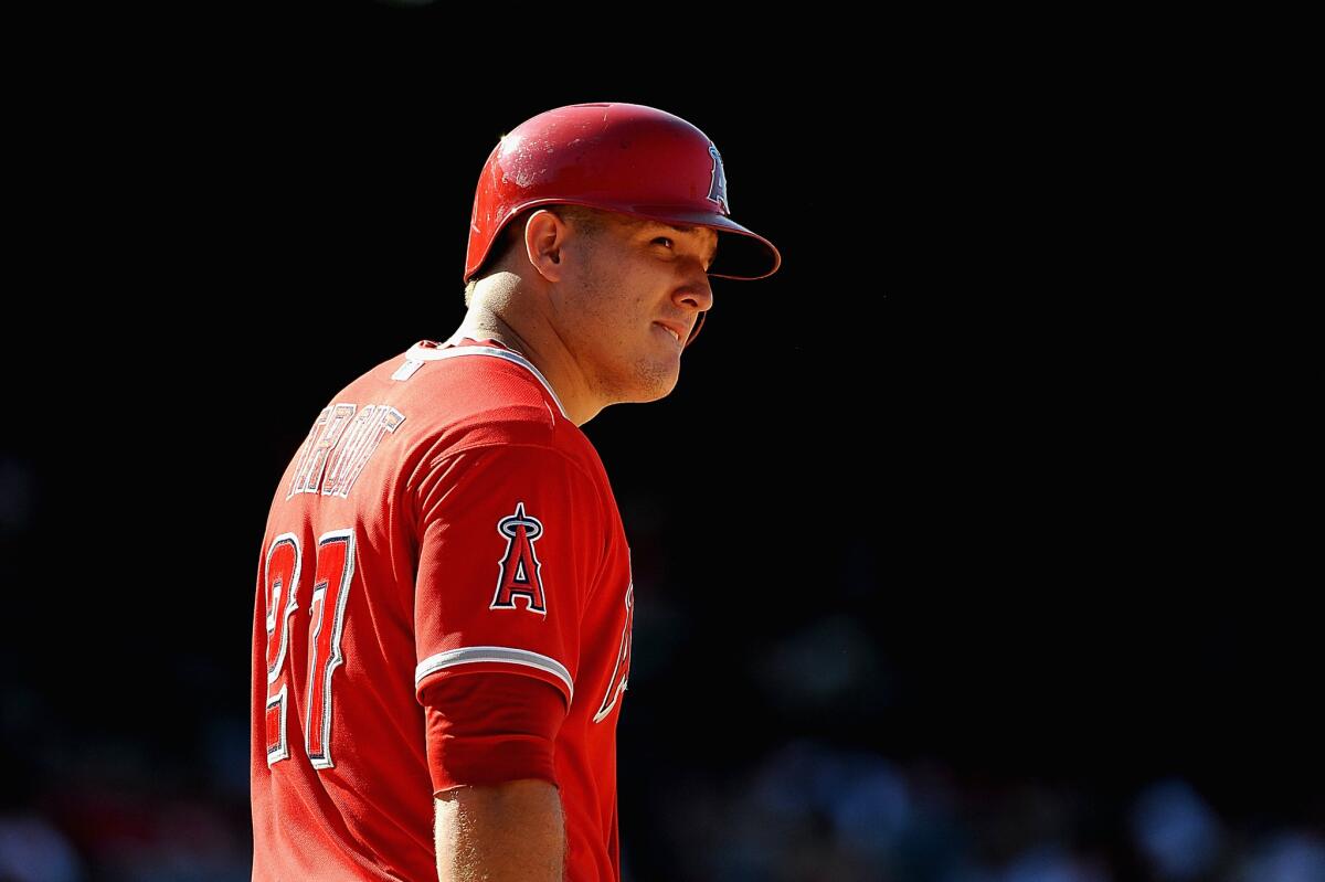 Outfielder Mike Trout was scratched from the Angels' lineup Tuesday because of a sore left heel.